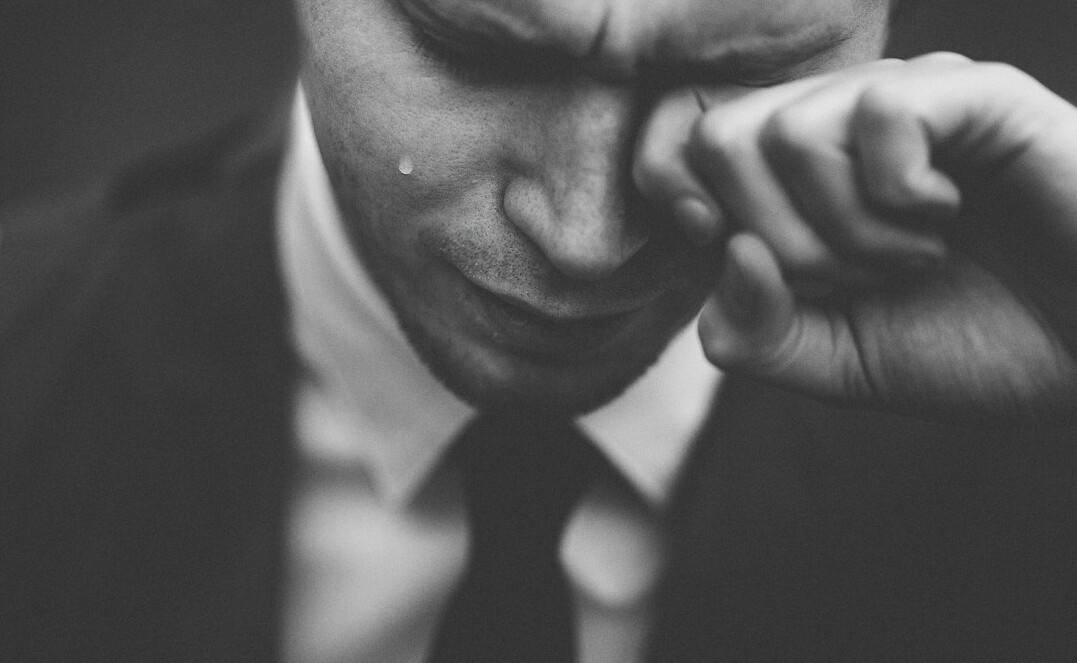 tired employee rubbing eyes